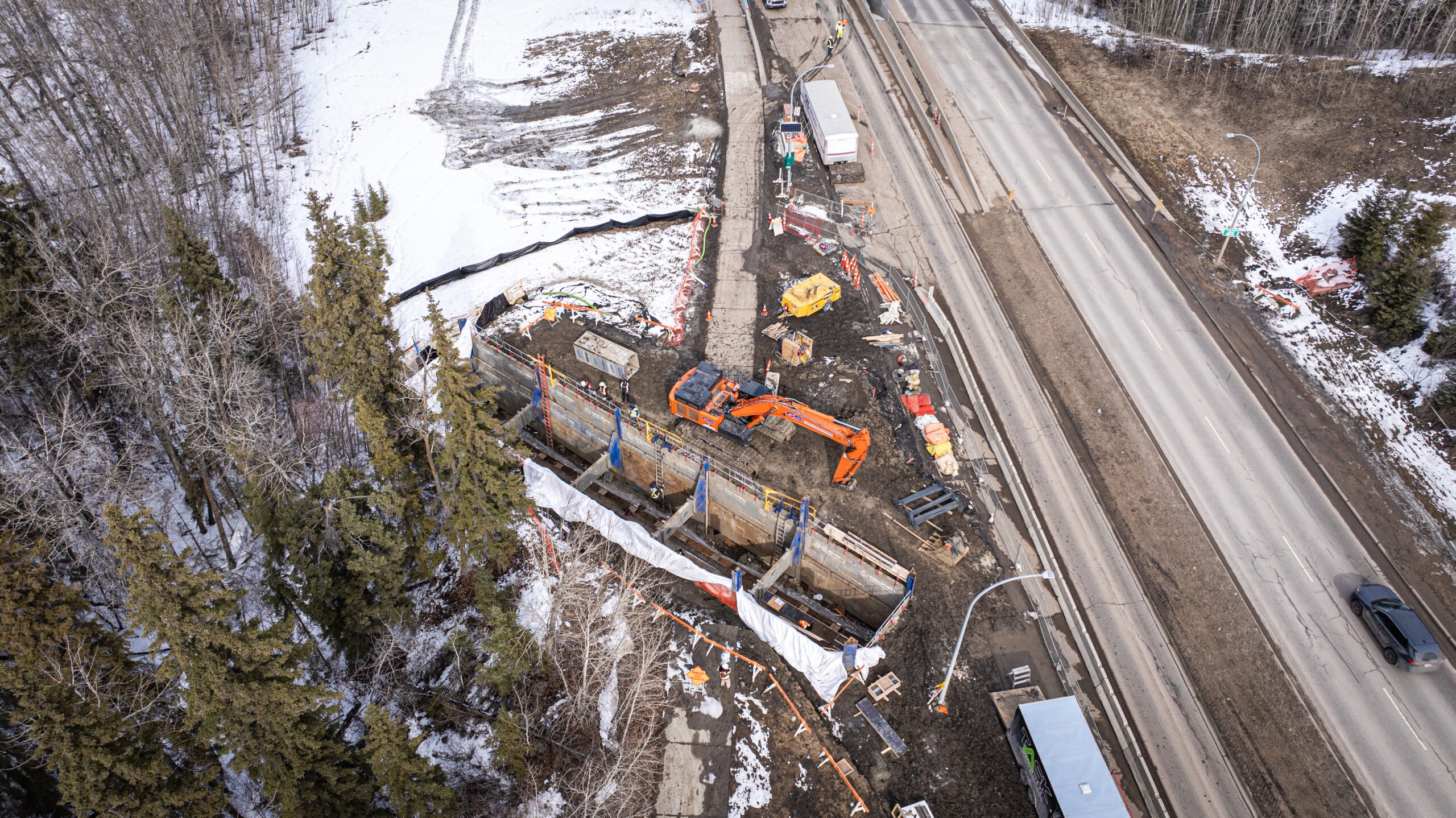 Large-diameter watermain construction along 111 Street in Edmonton.