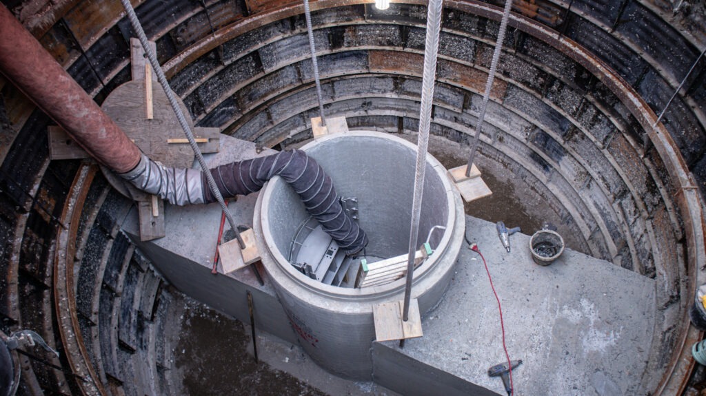 Manhole installation within a tunnel plate liner as part of the PCL Outfall Control Gates project