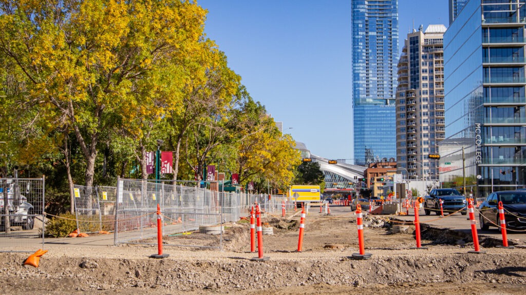 Designated pedestrian walkthrough maintained through an active construction site