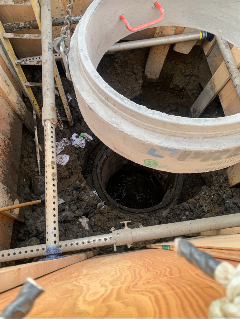 Installation of a new manhole barrel during SIRP manhole repair support work